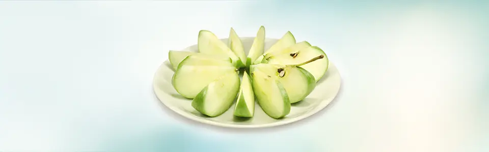 Apple slices precisely arranged on a plate